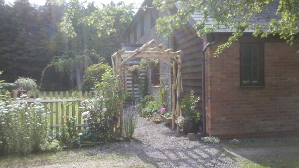 1 Cleft Chestnut bespoke rose arch and picket fencing Cleft Chestnut custom designed rose arch and picket fencing