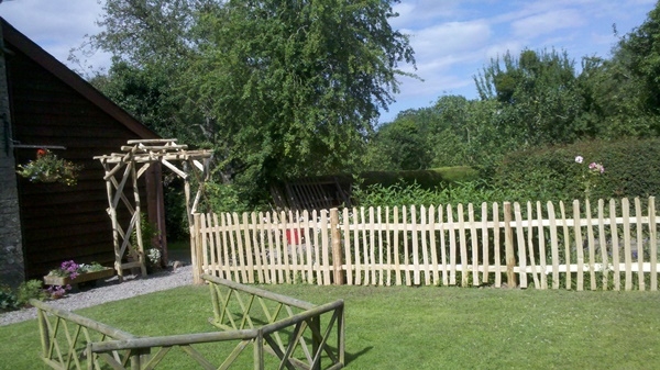 5 Cleft Chestnut besoke rose arch and picket fencing Cleft Chestnut custom designed rose arch and picket fencing