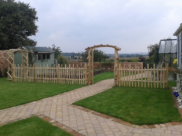 8 Cleft Chestnut rose arches and staggered height picket fencing Cleft Chestnut rose arches and staggered height picket fencing