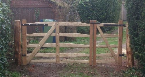 Pair of sawn Oak and cleft Chestnut Mordiford gates with blacksmith forged furniture Pair of sawn Oak and cleft Chestnut rustic Mordiford gates with blacksmith forged furniture