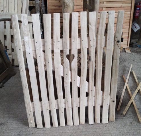 Bespoke gate made to match customers own home made gate with black furniture and cut out heart motif. Bespoke gate made to match customers own home made gate with black furniture and cut out heart motif.