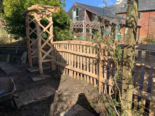 25 Cleft Chestnut rose arch and picket fence with hand rail Cleft Chestnut rose arch and picket fence with hand rail