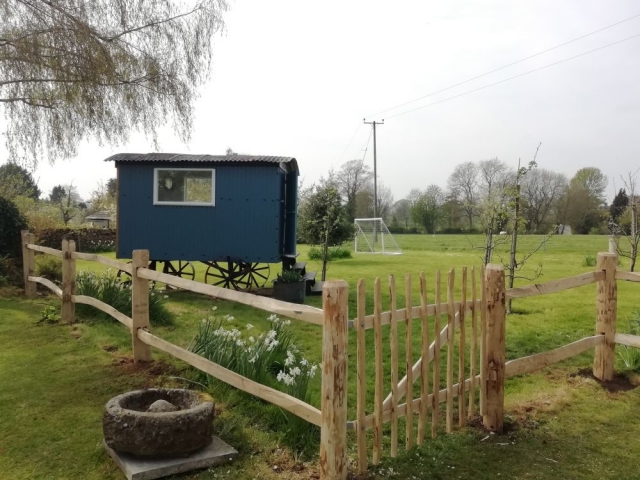 Post and rail fencing with a wicket gate set this pretty Shepherd's hut off nicely Post and rail fencing with a cleft wicket gate set this pretty Shepherd's hut off nicely