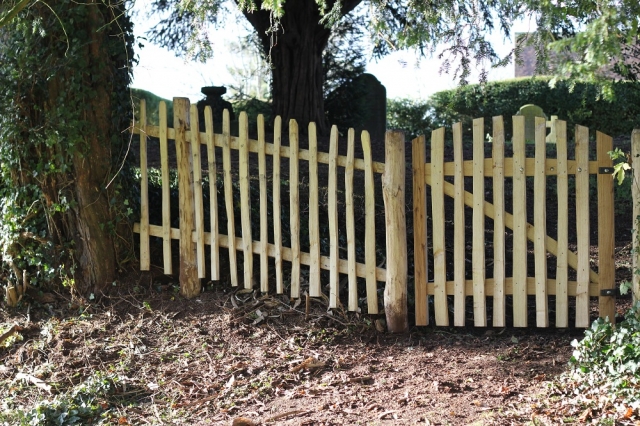 Avenbury gate and cleft picket fencing in a churchyard Avenbury gate and cleft picket fencing in a churchyard