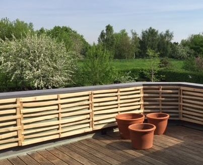 1 Wider spaced cleft lath panel to soften a balcony Wider spaced Chestnut cleft lath panel to soften a balcony