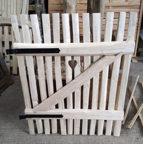 Bespoke gate made to match customers own home made gate with black furniture and cut out heart motif. Bespoke gate made to match customers own home made gate with black furniture and cut out heart motif.