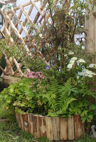 12 Cleft Chestnut diamond trellis panel and log roll planter Cleft Chestnut diamond trellis panel and log roll planter