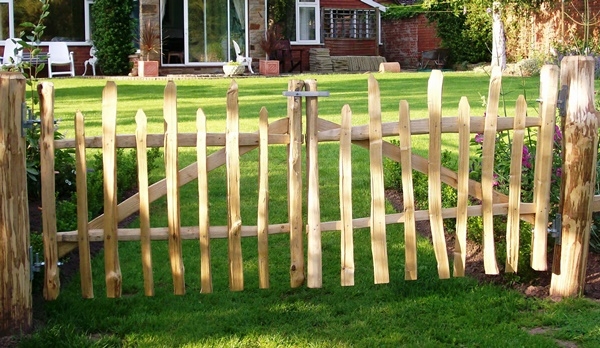 Pair of cleft Chestnut wicket gates, with staggered height top Pair of rustic cleft Chestnut wicket gates, with staggered height top