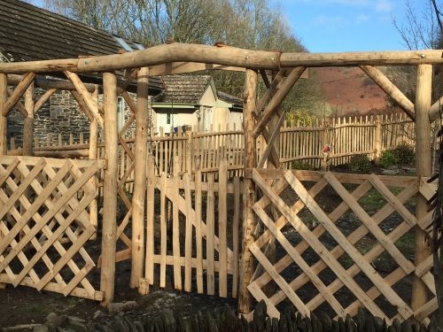 Rosearch, gate, trellis and fence, supplied as kit, installed by customer Chestnut Rosearch, gate, trellis and fence, supplied as kit, installed by customer