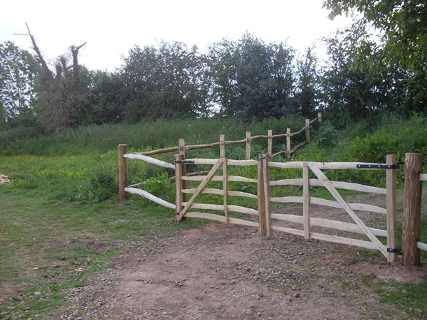 A pair of Cleft Chestnut Mordiford gates with bespoke post and rail fencing A pair of Cleft Rustic Chestnut Mordiford gates with bespoke post and rail fencing